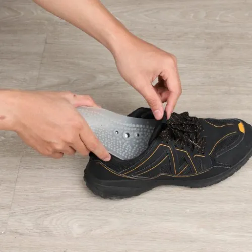 inserting PureInSole in a black sneakers